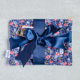 a matching set of pouches tied with a satin ribbon